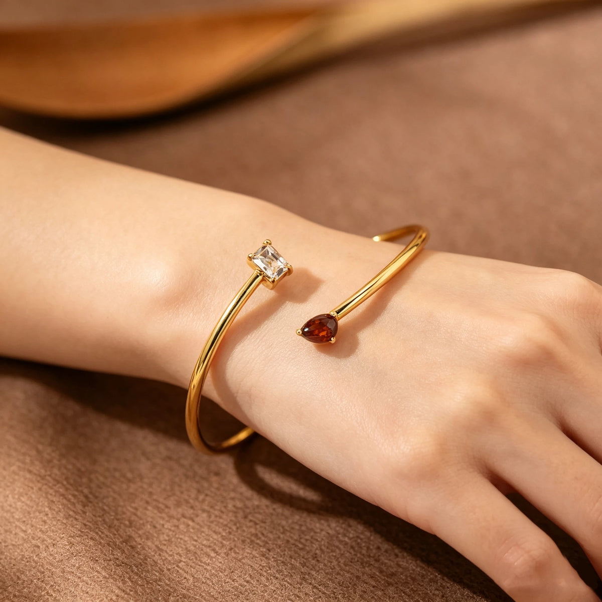 Gold-tone bracelet with rectangular and heart-shaped crystals
