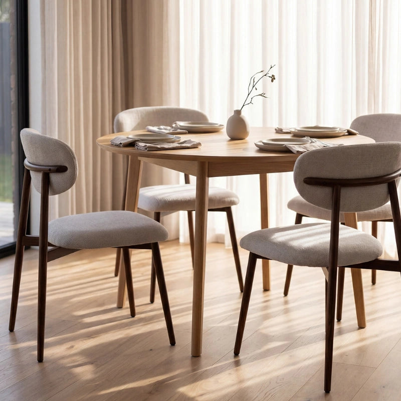 Set of two upholstered Japandi dining chairs in a neutral dining room