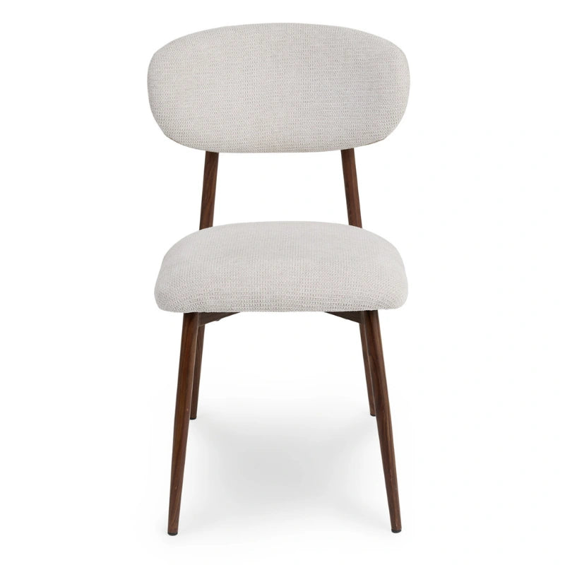 Front view of a light grey upholstered Japandi dining chair