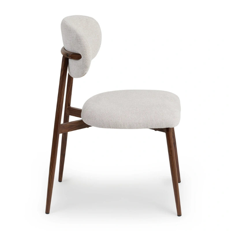Side view showing the armless profile and angled legs of a Japandi dining chair