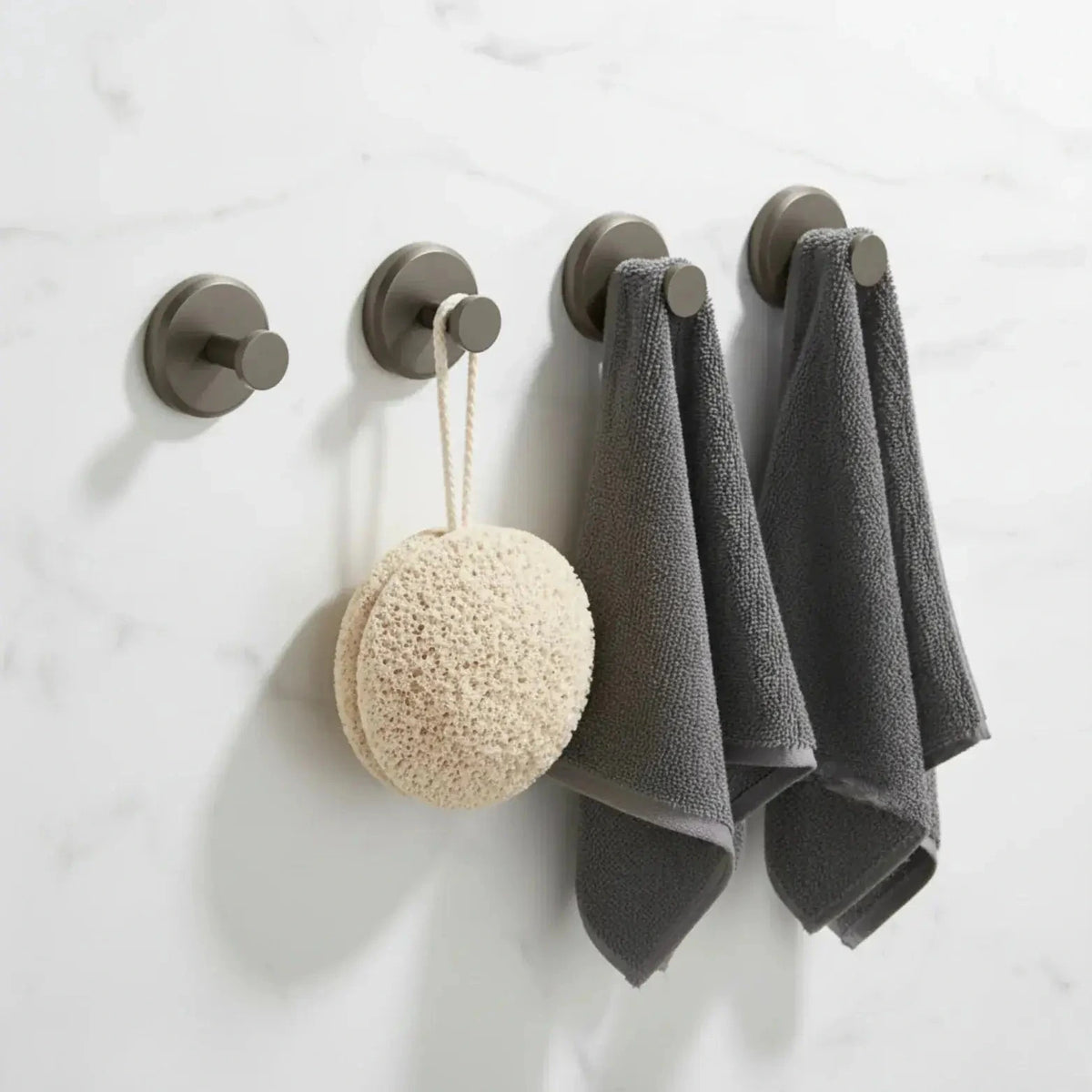 Set of four slate suction cup hooks shown on a bathroom wall