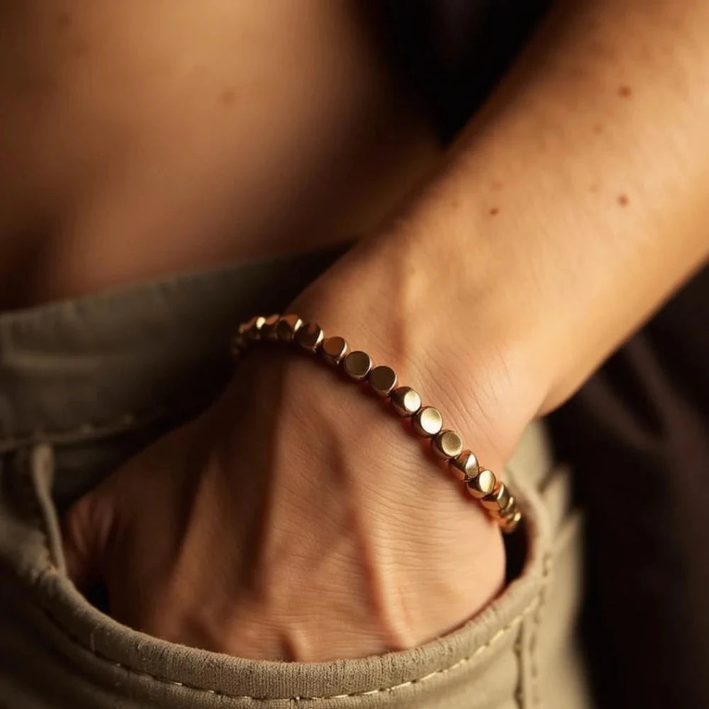 Tibetan-style copper and brass bracelet worn on the wrist