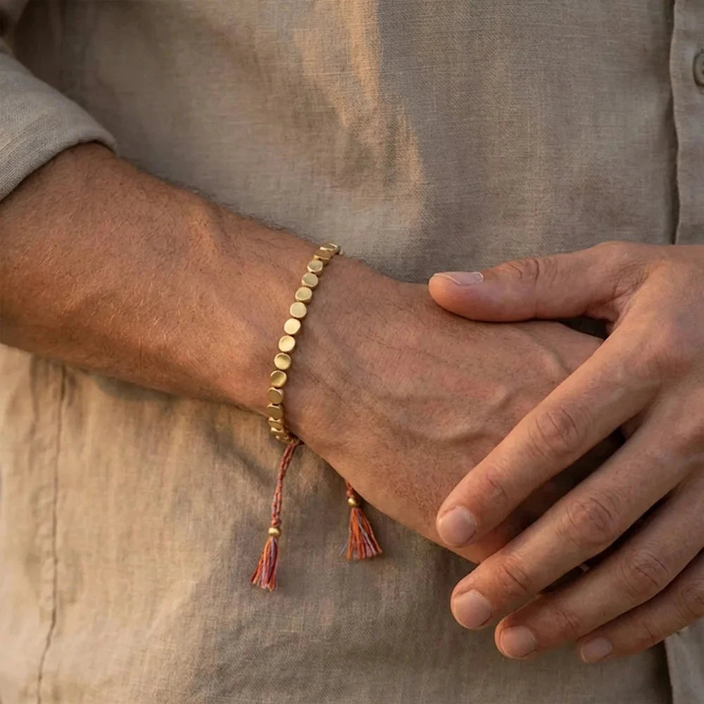 Copper and brass bead bracelet worn with a neutral shirt