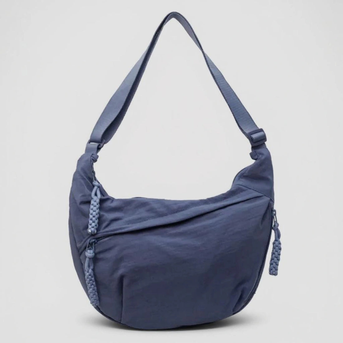 Black crossbody shoulder bag with zipped pockets and an adjustable strap